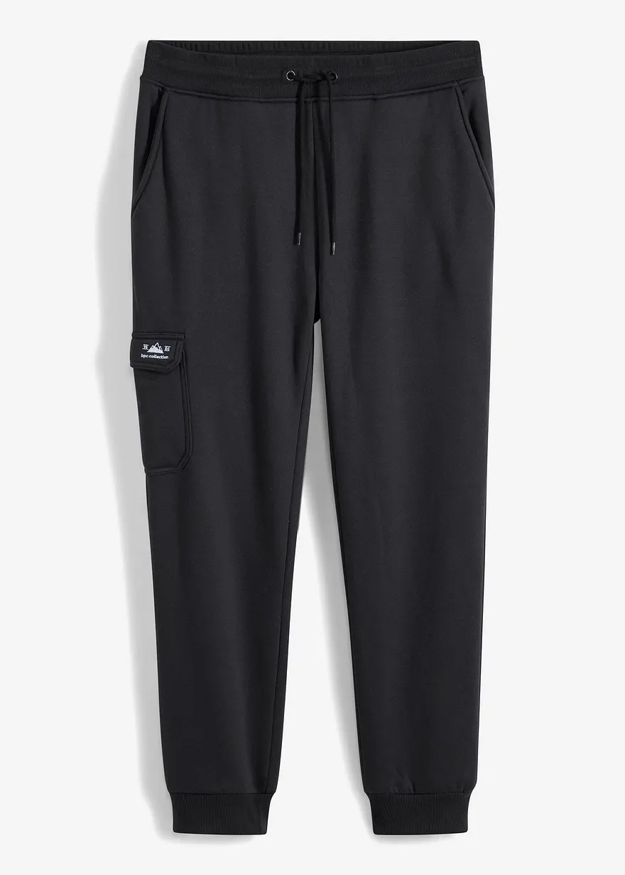 Thermo-Jogginghose mit Cargo-Taschen und Teddyfutter in schwarz von vorne - bonprix Thermo-Jogginghose mit Cargo-Taschen und Teddyfutter in schwarz von vorne - bonprix
