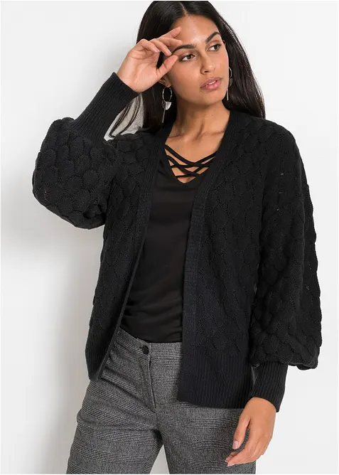 Ajour-Strickjacke mit Pufferärmel in schwarz von vorne (im Anschnitt) - bonprix