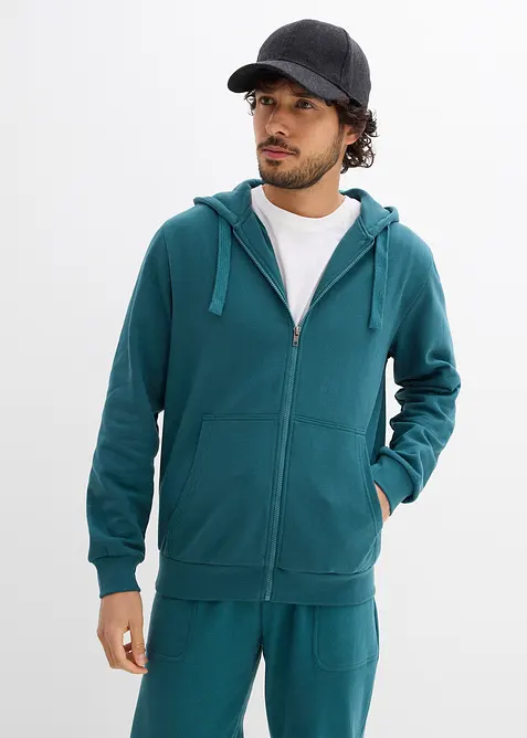 Kapuzen-Sweatjacke aus weichem Baumwoll-Mix in petrol von vorne (im Anschnitt) - bonprix