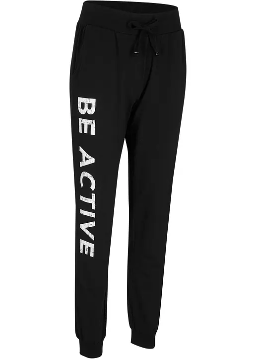 Jogginghose aus Baumwolle mit Druck, Loose Fit in schwarz von vorne - bonprix