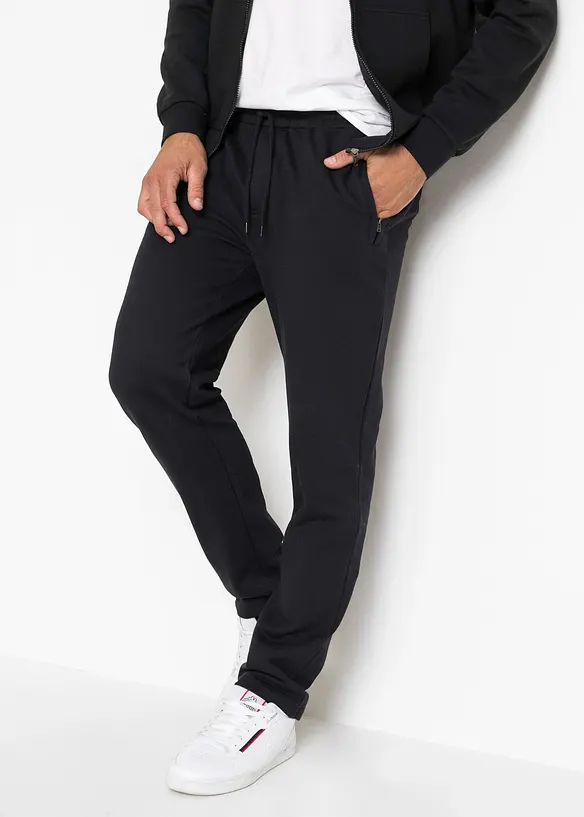 Jogginghose mit Reißverschlusstaschen in schwarz von vorne - bonprix