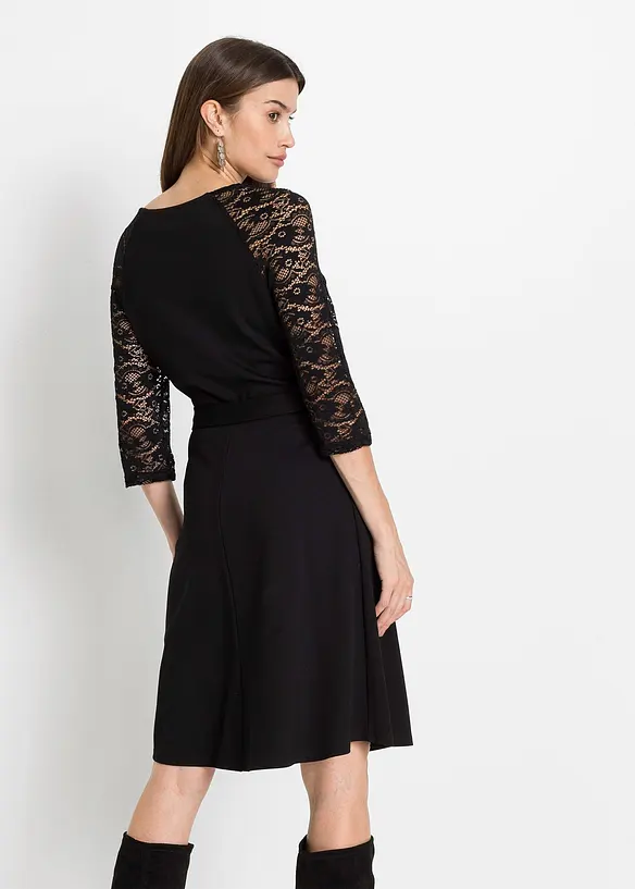 Jerseykleid mit ausgestelltem Rockteil in schwarz von hinten (Totalaufnahme) - bonprix