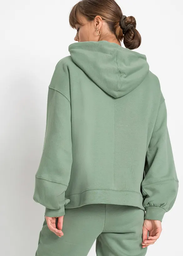 Oversize-Kapuzen-Sweatshirt aus weichem Baumwoll-Mix in grün von hinten (im Anschnitt) - bonprix