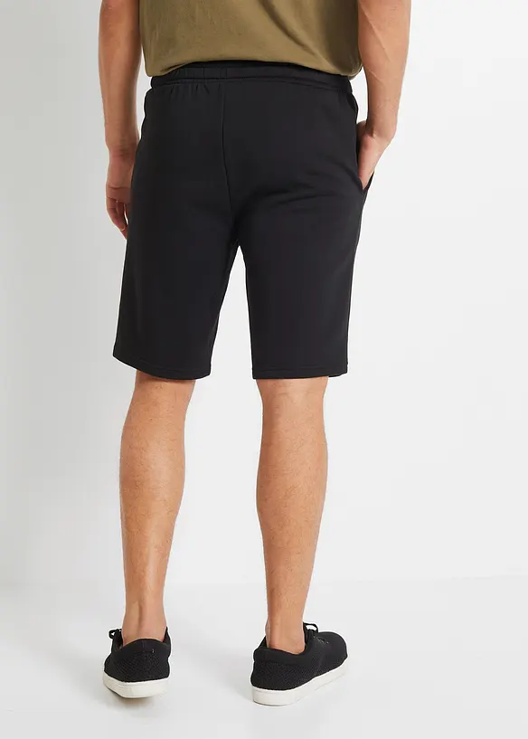 Sweat-Bermuda in Regular Fit in schwarz von hinten - bonprix