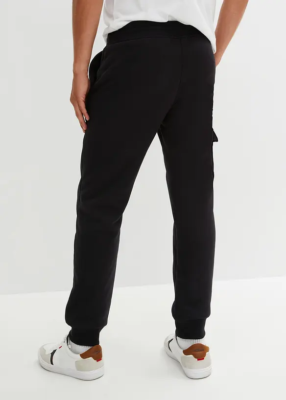 Thermo-Jogginghose mit flauschigem Teddyfleece in schwarz von hinten - bonprix