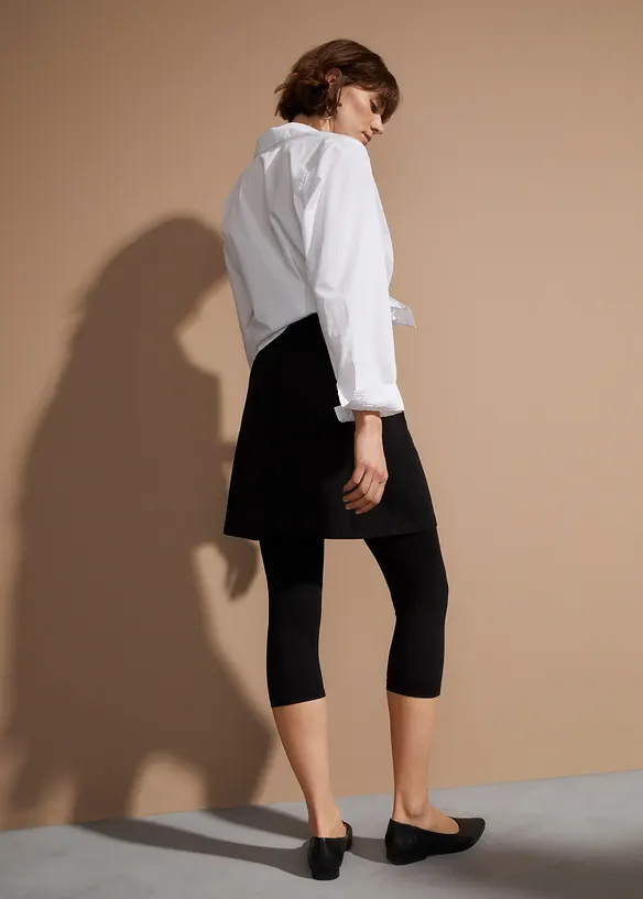 Capri-Leggings mit Rock aus elastischem Baumwoll-Mix in schwarz von hinten - bonprix Capri-Leggings mit Rock aus elastischem Baumwoll-Mix in schwarz von hinten - bonprix