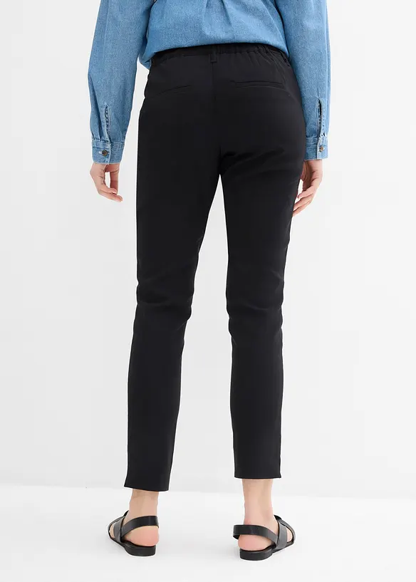 Stretch- Umstandshose mit schmal zulaufendem Bein in schwarz von hinten - bonprix