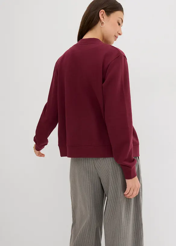 Sweatjacke mit Knopfleiste in rot von hinten (im Anschnitt) - bonprix