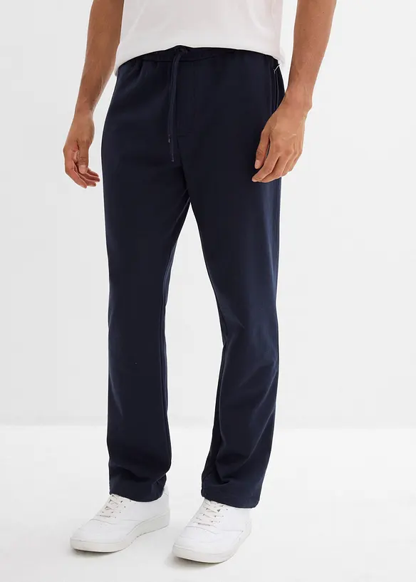 Jogginghose mit Reißverschlusstaschen in blau von vorne - bonprix