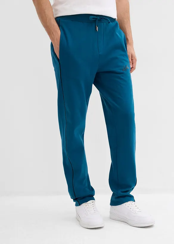 Jogginghose mit Kontrastdetails aus reiner Baumwolle in petrol von vorne - bonprix