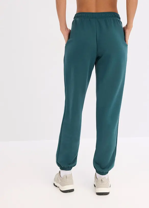 Ultrasofte Sport-Jogginghose mit Modal in petrol von hinten - bonprix
