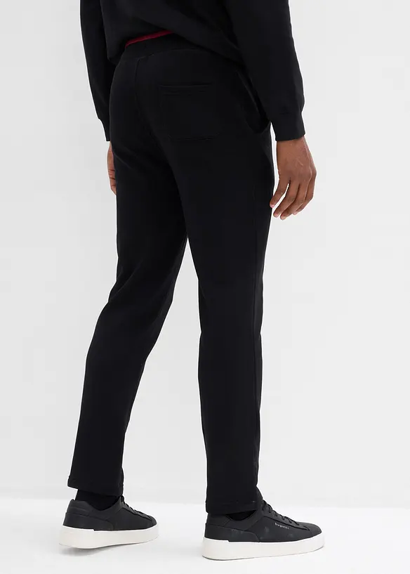 Jogginghose in Regular Fit in schwarz von hinten - bonprix