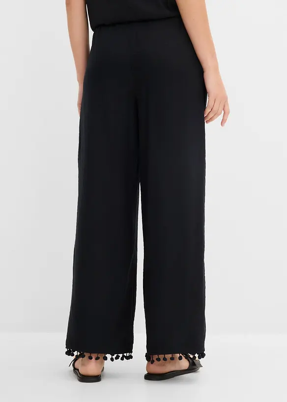 Schlupfhose aus fließendem Viskose-Mix in schwarz von hinten - bonprix