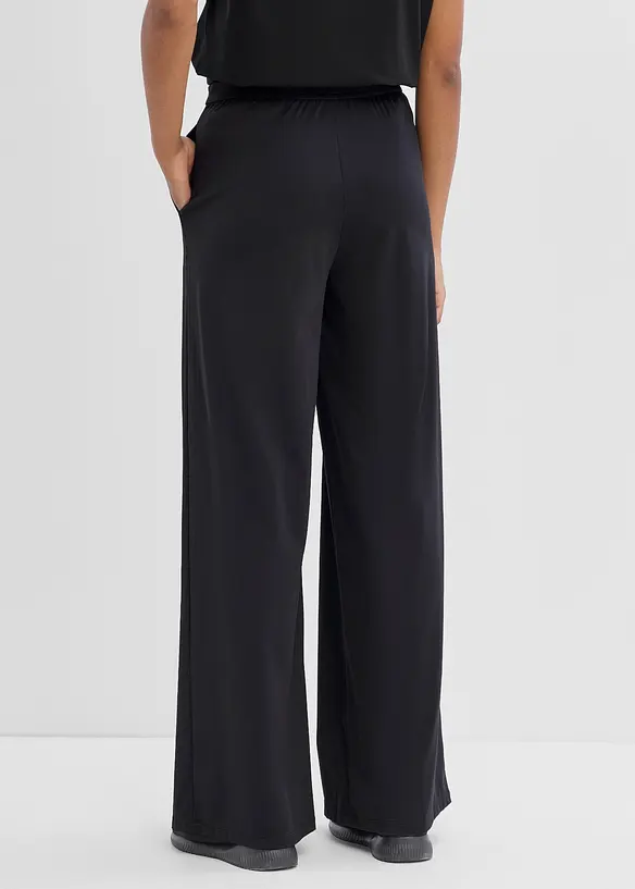 Ultraleichte Sporthose mit Zierfalten, schnelltrocknend in schwarz von hinten - bonprix Ultraleichte Sporthose mit Zierfalten, schnelltrocknend in schwarz von hinten - bonprix