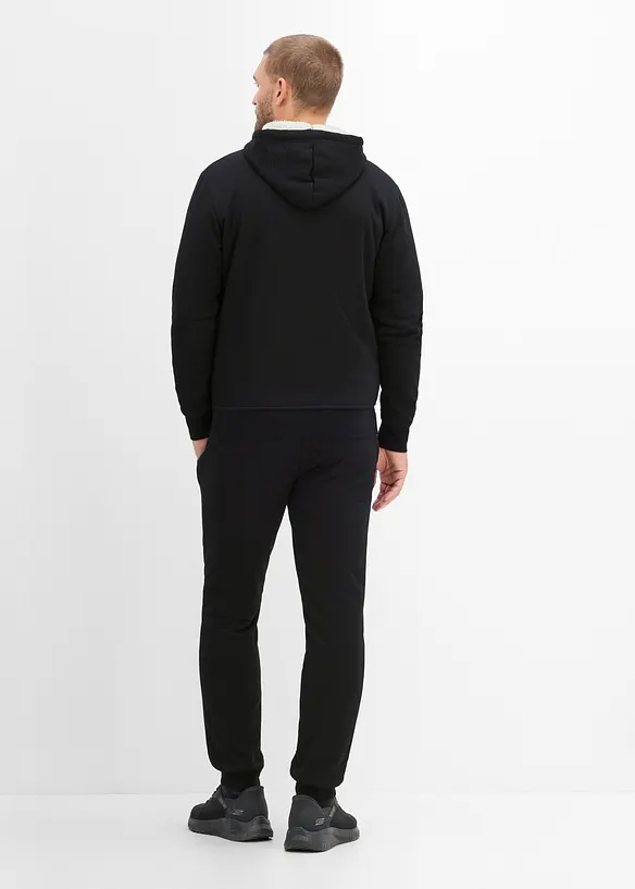 Thermo-Jogginganzug mit flauschigem Teddyfleece in schwarz von hinten (Totalaufnahme) - bonprix