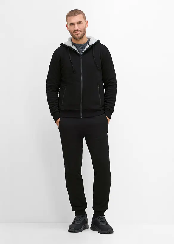 Thermo-Jogginganzug mit flauschigem Teddyfleece in schwarz von vorne (Totalaufnahme) - bonprix