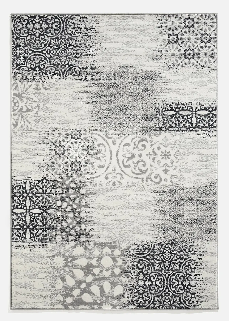 Teppich mit Patchworkmusterung in grau - bonprix